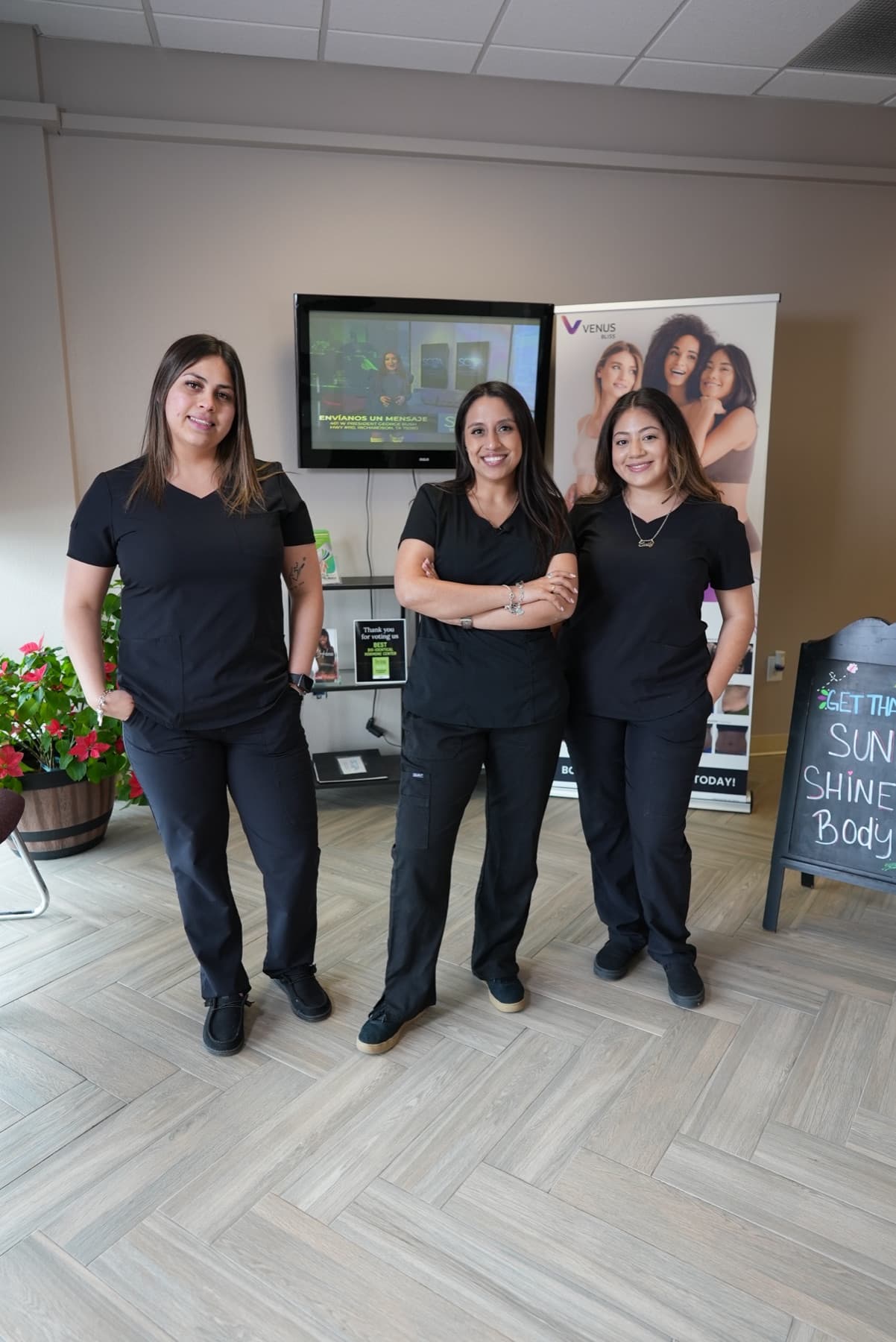 Three Soza Clinic team members in scrubs at the Richardson clinic